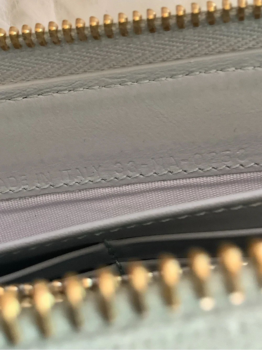 Christian Dior Voyageur wallet made of sage green patent leather
